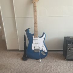 Blue Stratocaster with amp cables included