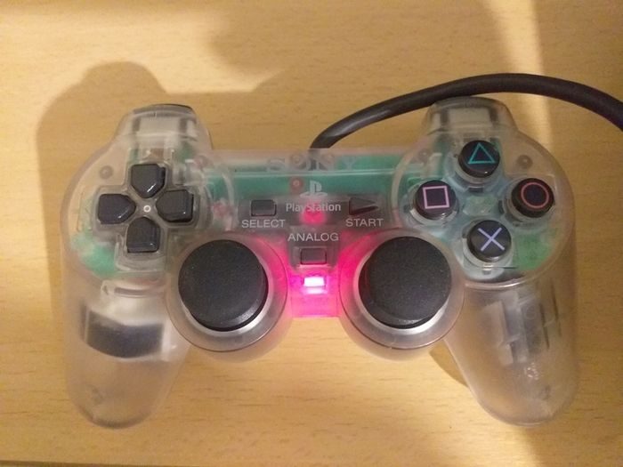 Sony PlayStation 2 console with two controllers