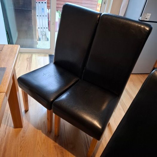 4 Black leather style kitchen chairs. Very few scuff marks 80