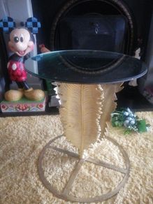 unusual gold palm leaf mirror top table
