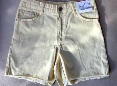 Girls pale yellow mid rise shorts