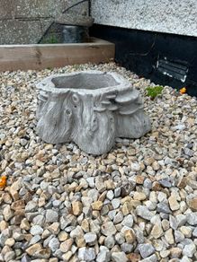 Decorative stone tree stump planter