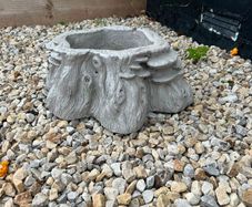 Decorative stone tree stump planter