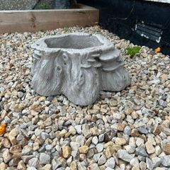 Decorative stone tree stump planter