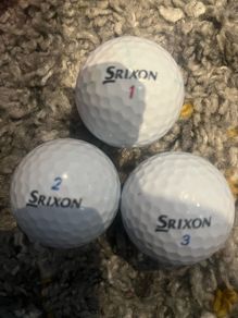 Three Srixon golf balls