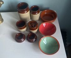 Selection of stoneware jars and condiment holders and Three little dishes added