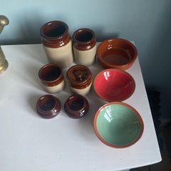 Selection of stoneware jars and condiment holders and Three little dishes added