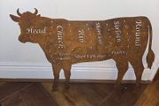 Rusted butchers cow silhouette