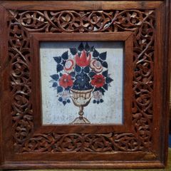 Flowers with carved wooden frame