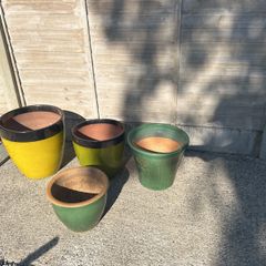Four glazed green garden pots