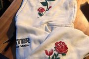 White Hollister hoody with roses