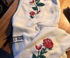 White Hollister hoody with roses