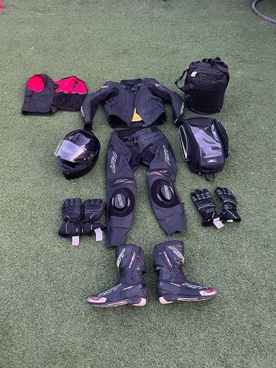 Motor cycle racing leathers with boots, gloves and helmet.