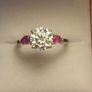 Moissanite Solitaire Ring with Natural Ruby Accents Image 2