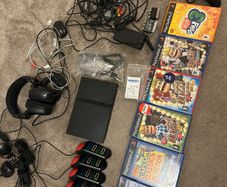 Playstation 2 with games and controllers