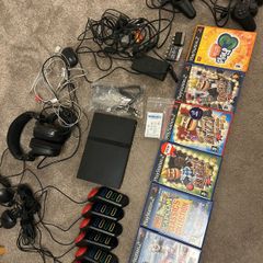 Playstation 2 with games and controllers