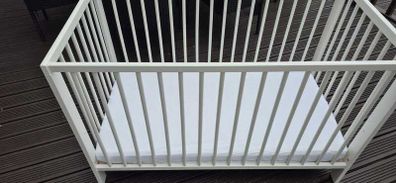 Cot bed with mattress and bedding