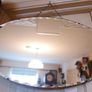 Vintage Art Deco Mirror. Scalloped bevelled edge frameless round wall mirror. Ready to hang on original visible chain. 25" x 15" Image 4