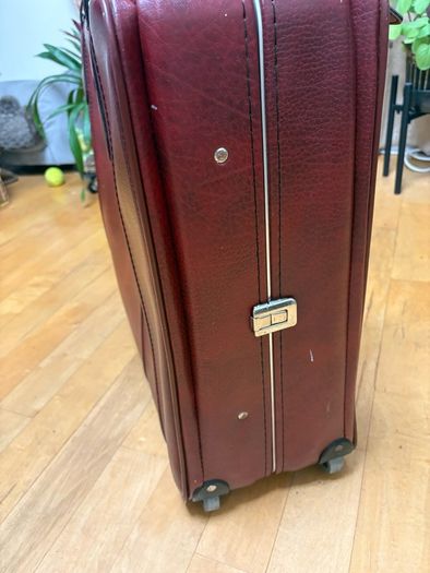 Vintage burgundy faux-leather suitcase
