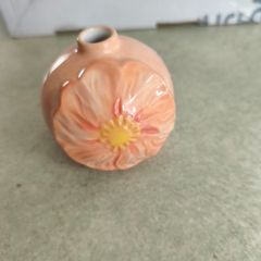 Next small bud vase or candle holder.