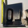 bookends made of cast metal likely aluminum that spell love Image 4