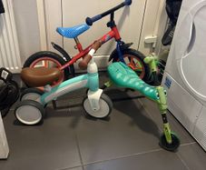 Two toddler bikes and a balance bike