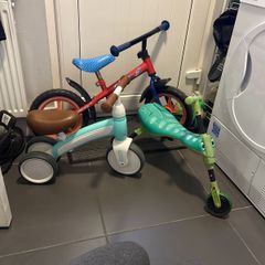 Two toddler bikes and a balance bike