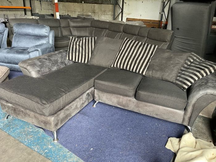 grey/black corner sofa with scatter cushions