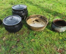 selection of old cast iron pots