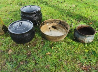 selection of old cast iron pots