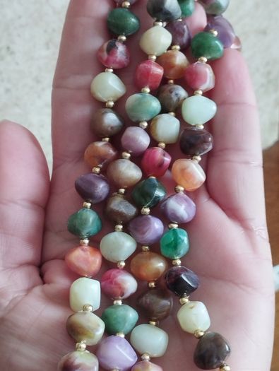 Necklace of multicolored artificial stones.
