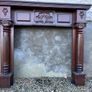 Wooden fireplace surround with carved details Image 3