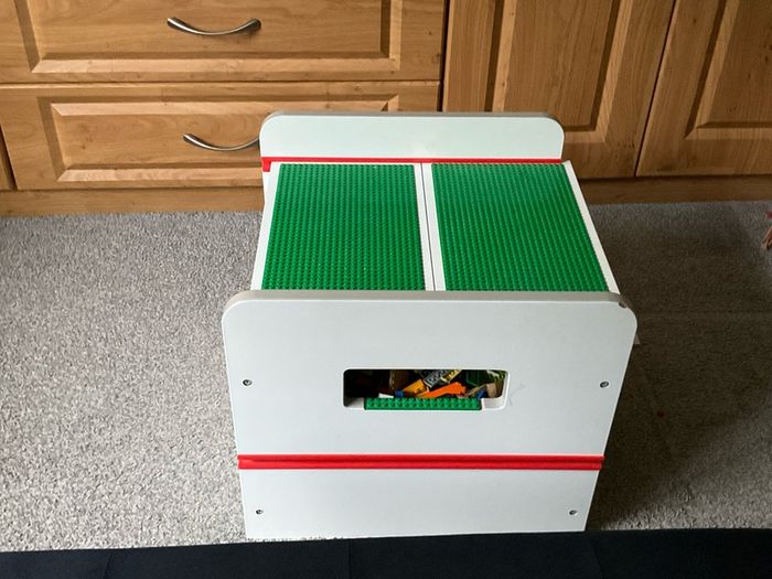 lego box and mixed lego pieces