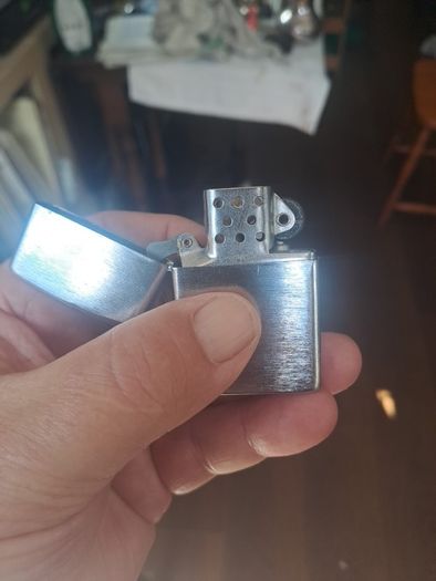 Champ Flip top petrol lighter.