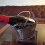 French wine bottle holder traditional table server 1950's. Woven wire basket. Image 10