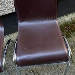 2 brown leatherette chairs