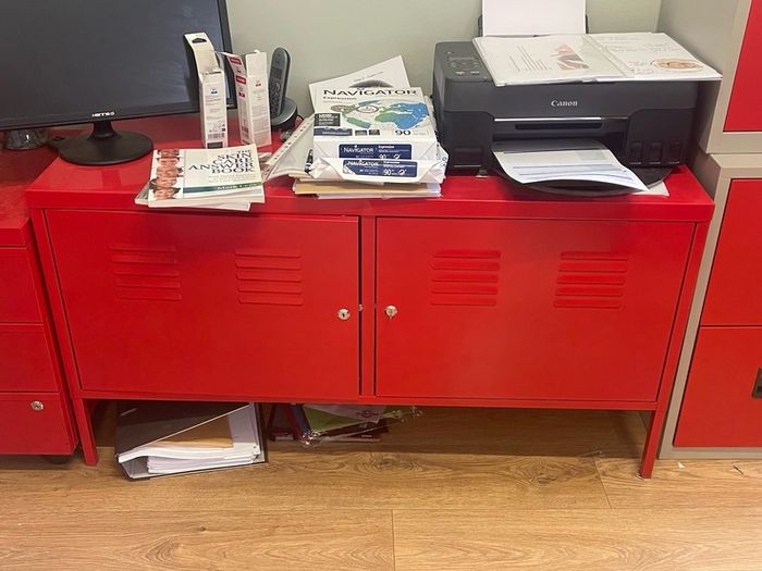 Red metal Ikea office cabinets