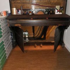 antique piano bar display