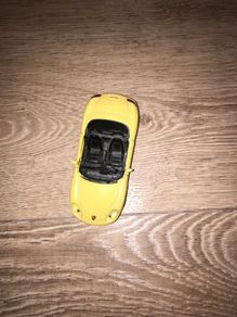 Toy car yellow Porsche Boxter