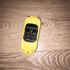 Toy car yellow Porsche Boxter