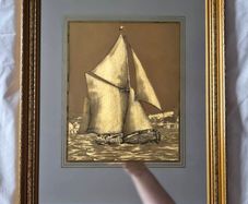 Vintage gold sailboat on mirror picture