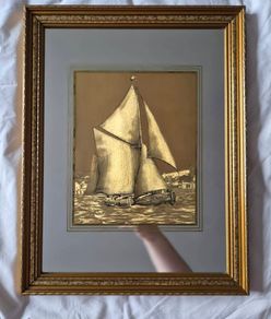 Vintage gold sailboat on mirror picture
