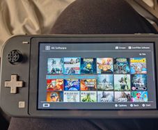 Nintendo switch lite + remote controller+ 20 games