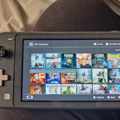 Nintendo switch lite + remote controller+ 20 games