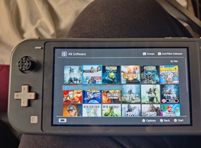 Nintendo switch lite + remote controller+ 20 games