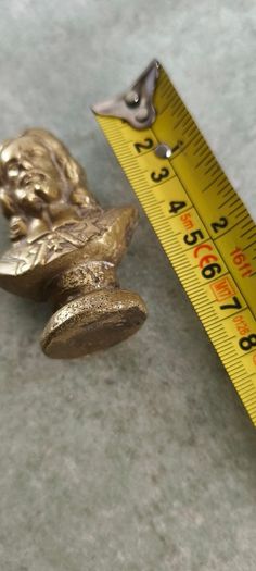 2 BRASS ITMEES-1- Primitive Antique Early Country Brass Push Up 9.5 INCHES Candlestick55.00 euro. 2- Brass Oliver Plunkett Tapper or papper wighte 60.00 euro.