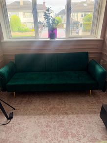 Gorgeous emerald green velvet sofa!