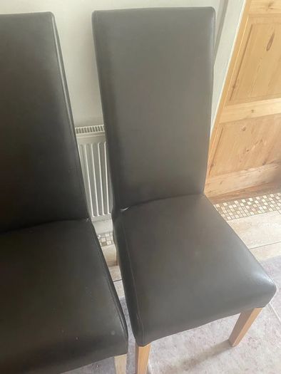 4 dark brown dining room chairs & 4 stretch covers