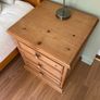 Solid antique pine three-drawer bedside locker Image 3