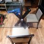 Walnut base and matching 4 chairs. Bevelled edge glass top Image 2
